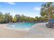 Relaxing pool area with lounge chairs and plenty of space for lounging at 7845 Oak Reflection Loop, Davenport, FL 33837