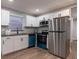 Well-lit kitchen featuring stainless steel appliances and modern cabinetry at 812 S Locust Ave, Sanford, FL 32771