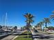 Scenic road view featuring palm trees, parked sailboats, blue skies, and waterfront views at 812 S Locust Ave, Sanford, FL 32771