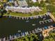 Aerial view of a waterfront condo community with private boat docks and lush landscaping at 8922 Bay Cove Ct, Orlando, FL 32819