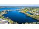 Stunning aerial view of a lakefront community featuring luxurious homes and beautiful waterfront properties at 8922 Bay Cove Ct, Orlando, FL 32819