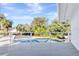 Balcony with white railings overlooking a backyard with a pool and tropical landscaping at 8922 Bay Cove Ct, Orlando, FL 32819