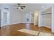Bright bedroom featuring hardwood floors, windows, ceiling fan, and built-in closets at 8922 Bay Cove Ct, Orlando, FL 32819