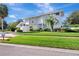 Stylish two-story home boasting a modern design and meticulous landscaping, creating a vibrant and inviting exterior at 8922 Bay Cove Ct, Orlando, FL 32819