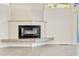 Modern fireplace in a well-lit living room with tile flooring, and a contemporary design at 8922 Bay Cove Ct, Orlando, FL 32819