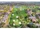 Expansive aerial view of a golf course community featuring well-manicured greens, lakes and luxurious homes at 8922 Bay Cove Ct, Orlando, FL 32819