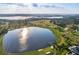 Scenic aerial view of a golf course and lake community, highlighting the serene environment at 8922 Bay Cove Ct, Orlando, FL 32819