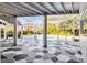 Spacious screened lanai with geometric flooring, offering a seamless transition to the outdoor pool area at 8922 Bay Cove Ct, Orlando, FL 32819