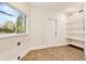 Laundry room features a large window, door to the backyard, and custom shelving at 8922 Bay Cove Ct, Orlando, FL 32819