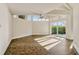 Sunlit living room featuring high ceilings, a ceiling fan, and sliding glass doors that lead to the outdoor area at 8922 Bay Cove Ct, Orlando, FL 32819