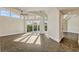 Spacious living room with high ceilings, a fan, and large sliding doors that let in natural light and offer great views at 8922 Bay Cove Ct, Orlando, FL 32819