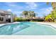 Inviting pool with steps, surrounded by lush landscaping and a screened lanai, creating a private oasis at 8922 Bay Cove Ct, Orlando, FL 32819