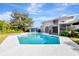 Refreshing pool area with a clear blue pool, adjacent to a lanai and a charming pool house at 8922 Bay Cove Ct, Orlando, FL 32819