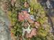 Aerial view of an estate featuring a large house, swimming pool, and lush landscaping at 9291 Point Cypress Dr, Orlando, FL 32836