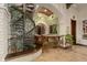 Decorative bar area with custom woodwork, seating, and a spiral staircase at 9291 Point Cypress Dr, Orlando, FL 32836