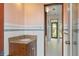 Bathroom features granite countertop vanity and a shower with glass doors leading to the outdoors at 9291 Point Cypress Dr, Orlando, FL 32836