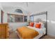 Inviting bedroom featuring a four-poster bed, a large window, and neutral decor at 9291 Point Cypress Dr, Orlando, FL 32836