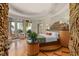 Unique bedroom features a round design, detailed woodwork, and a scenic lake view at 9291 Point Cypress Dr, Orlando, FL 32836