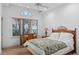 Bedroom with bamboo accents and large windows providing natural light and outdoor views at 9291 Point Cypress Dr, Orlando, FL 32836