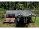 Aerial view of boat house with covered slips, deck, and surrounding waterway at 9291 Point Cypress Dr, Orlando, FL 32836