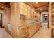 Well-appointed butler's pantry with custom cabinetry, granite countertops, and elegant finishes at 9291 Point Cypress Dr, Orlando, FL 32836