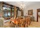 Elegant dining room with decorative columns, wood accents, and ample natural light at 9291 Point Cypress Dr, Orlando, FL 32836