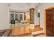 Bright exercise room with hardwood floors and large windows for natural light and great views of the landscape at 9291 Point Cypress Dr, Orlando, FL 32836