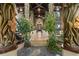The foyer boasts carved columns, unique flooring, and an inviting view of the home's interior at 9291 Point Cypress Dr, Orlando, FL 32836