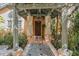 Charming front entrance with stone columns, and a covered walkway at 9291 Point Cypress Dr, Orlando, FL 32836