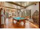 Entertainment room with a pool table, decorative millwork, and a vintage jukebox at 9291 Point Cypress Dr, Orlando, FL 32836