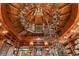 Unique library featuring a spiral staircase under an elaborate wood ceiling with shelving at 9291 Point Cypress Dr, Orlando, FL 32836