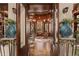 Elegant library entrance with double doors and intricate woodwork at 9291 Point Cypress Dr, Orlando, FL 32836