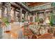Spacious living room with decorative columns, comfortable seating, and a grand piano at 9291 Point Cypress Dr, Orlando, FL 32836