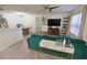 Spacious living room featuring contemporary design, a sleek TV, and decorative shelving at 974 Leeward Pl # 205, Altamonte Springs, FL 32714