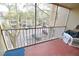 Balcony in the sun offers a cozy space to unwind and enjoy the outdoors with a view of the trees at 974 Leeward Pl # 205, Altamonte Springs, FL 32714