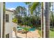 Aerial view of a backyard showcasing a luxurious pool, spa, lush landscaping, and architectural features at 11324 Bridge House Rd, Windermere, FL 34786