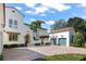 Elegant home with a brick driveway and side-entry three-car garage at 11324 Bridge House Rd, Windermere, FL 34786