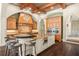 Spacious kitchen featuring a coffered ceiling, an oversized island, and built-in appliances at 11324 Bridge House Rd, Windermere, FL 34786