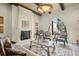 Cozy living room with fireplace, decorative rug, and arched window for a refined and inviting ambiance at 11324 Bridge House Rd, Windermere, FL 34786