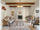 Formal living room featuring custom fireplace, high beamed ceiling, tile flooring and large windows at 11324 Bridge House Rd, Windermere, FL 34786