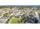 This aerial view shows a well-planned community with single-Gathering homes, green spaces, and a tranquil atmosphere at 123 Vitoria Rd, Davenport, FL 33837