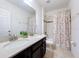 Bathroom featuring double vanity with granite countertops and a shower and tub combination at 123 Vitoria Rd, Davenport, FL 33837