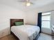 Bedroom with a bed, white quilt, and a window with curtains at 123 Vitoria Rd, Davenport, FL 33837