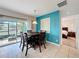 Dining room with sliding glass doors and a modern light fixture at 123 Vitoria Rd, Davenport, FL 33837