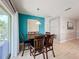 Dining room featuring a wooden table, chairs, and a sliding door at 123 Vitoria Rd, Davenport, FL 33837