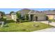 Well-maintained home boasts lush landscaping, a two-car garage, and a inviting curb appeal at 123 Vitoria Rd, Davenport, FL 33837