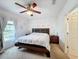 Main bedroom features neutral color palette and decorative accent wall at 123 Vitoria Rd, Davenport, FL 33837