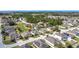 An aerial view of a suburban neighborhood with well-maintained homes and green spaces at 123 Vitoria Rd, Davenport, FL 33837