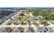 Aerial view of a well-planned neighborhood with similar styled single-Gathering homes and green spaces at 123 Vitoria Rd, Davenport, FL 33837