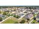 Aerial view of a residential community with diverse homes and green spaces in an open layout at 123 Vitoria Rd, Davenport, FL 33837